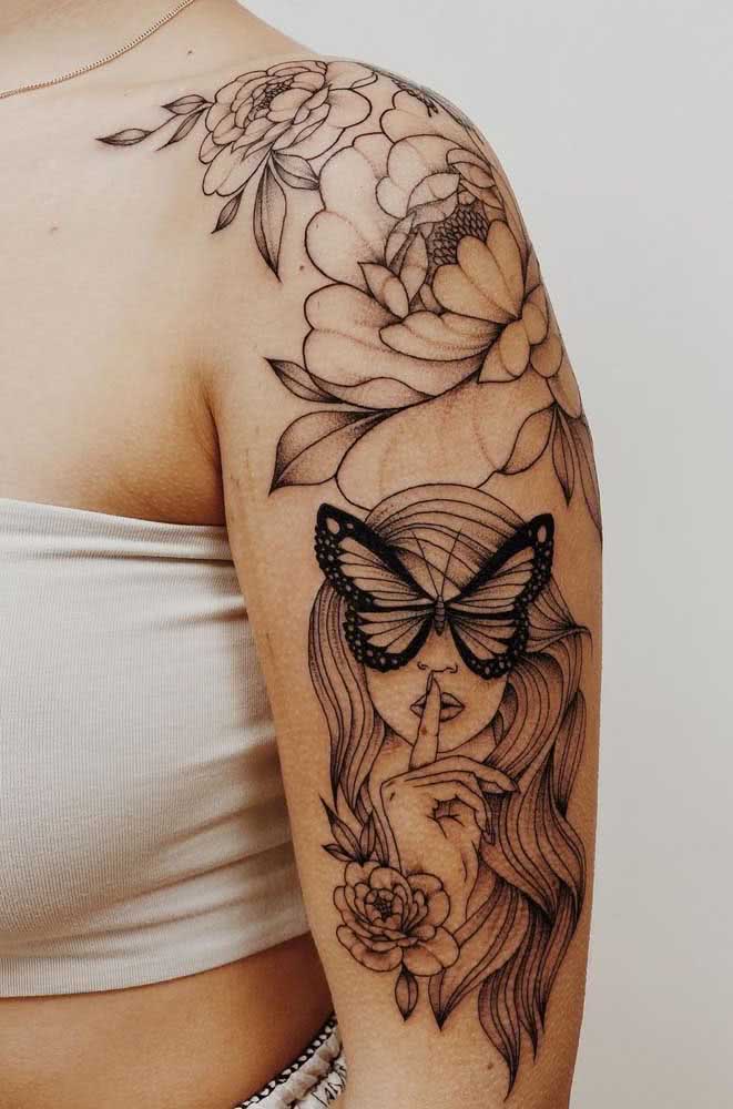 A borboleta aparece em destaque, como elemento central desta composição com um rosto feminino e muitas, muitas flores. 